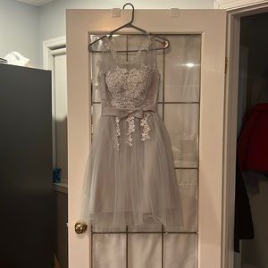 Grey mini dress accented with stitched flowers.